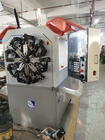 鳥取三洋電機モーターを搭載するカム設計CNCのばね機械ワイヤー前のベンダーの回転式機械